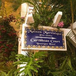 Sign to The Caribbean Court Boutique Hotel and Maison Martinique Restauarant in Vero Beach Florida