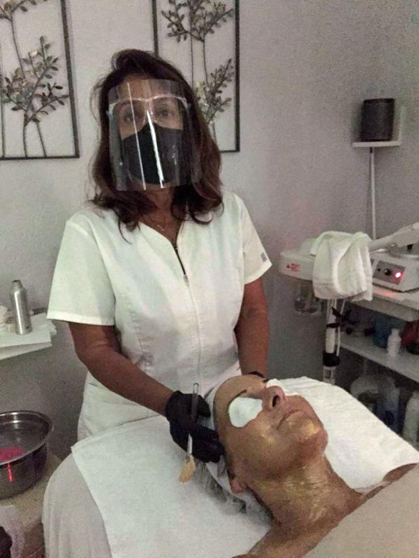 Lady getting a skin treatment while sitting in chair