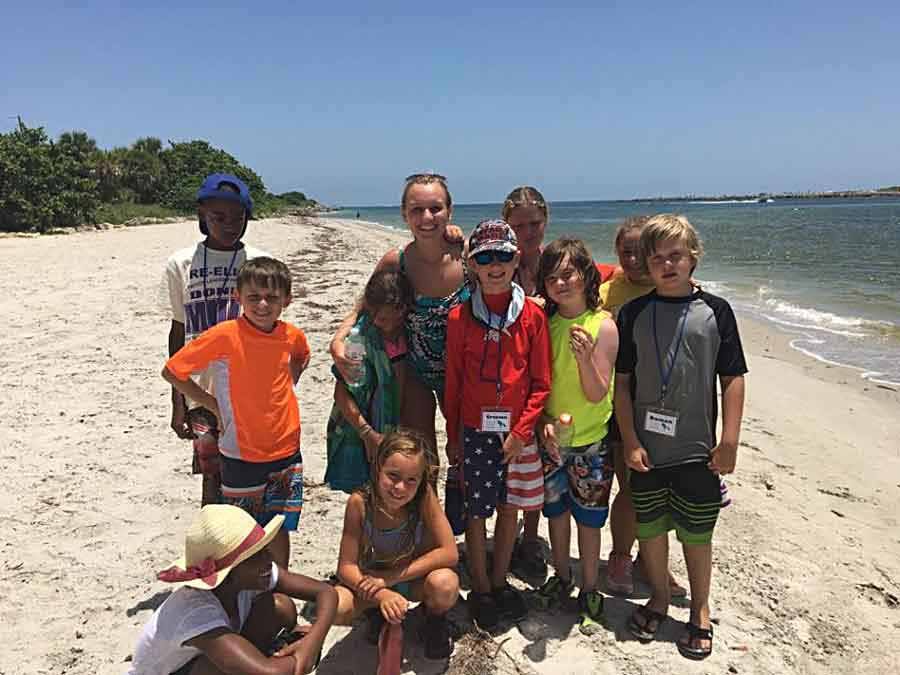 Kids on beach at the Manatee Observation and Education Center Fort Pierce Florida