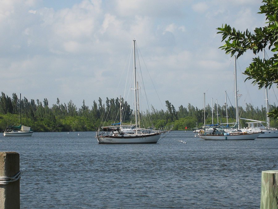 View of boats moored in river from Marina dock