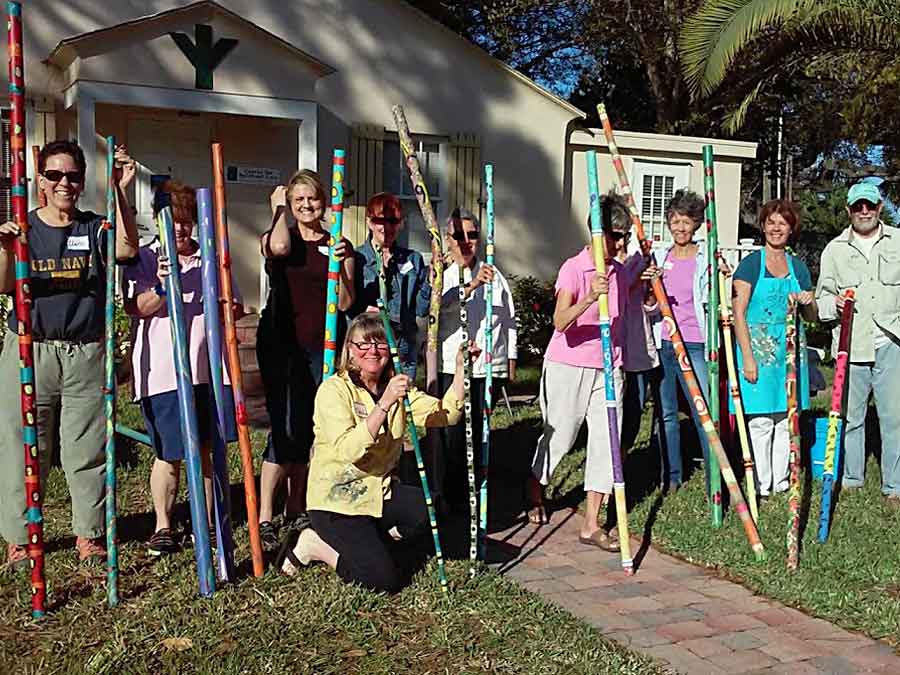 Center for Spiritual Care Vero Beach Florida group holding painted bamboo