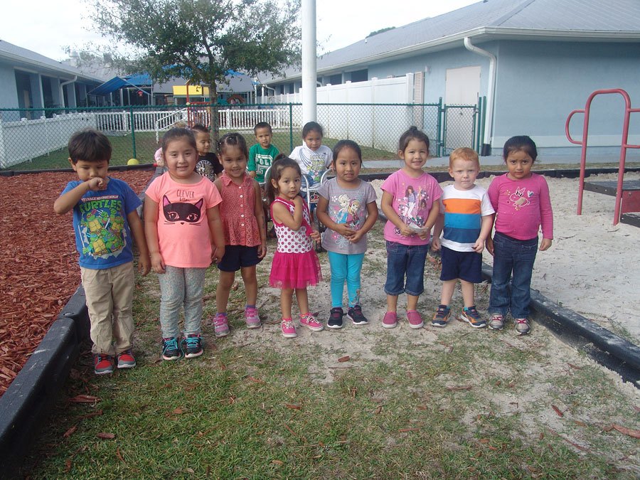 Small children posing for photo in playground