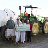 Shining Light Garden Foundation receiving giant check