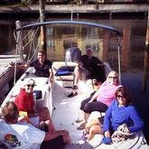 Family sitting on a Pontoon boat