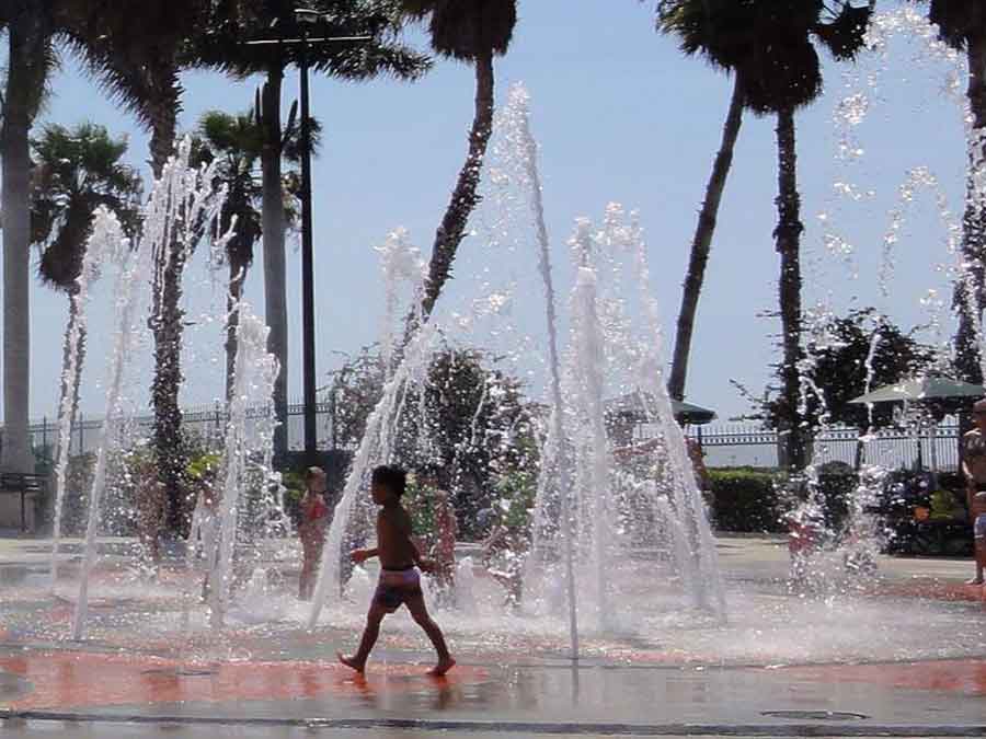 Child walking through water at fountains