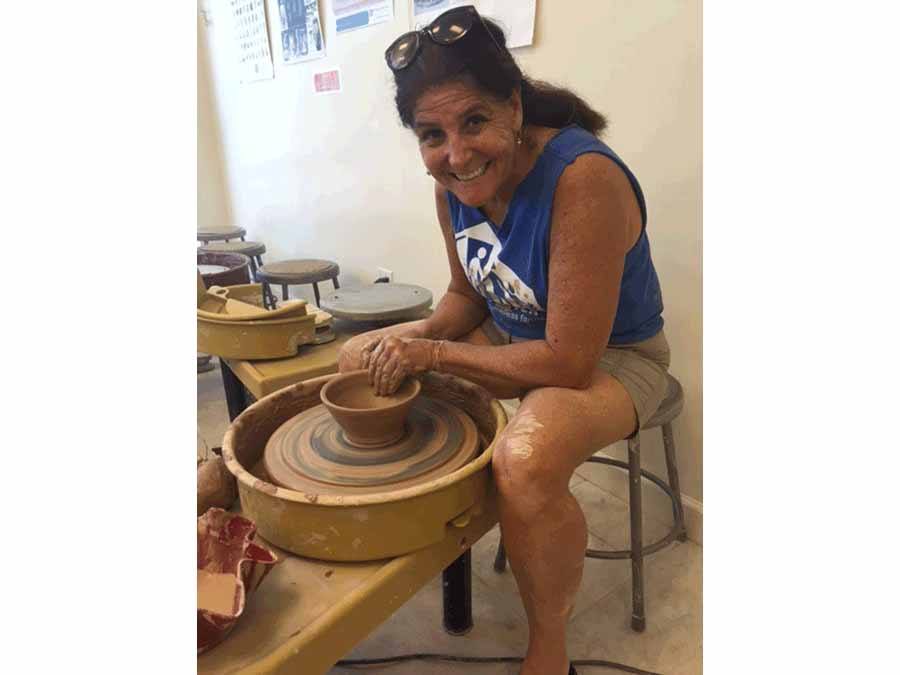 woman on potters wheel making a bowl