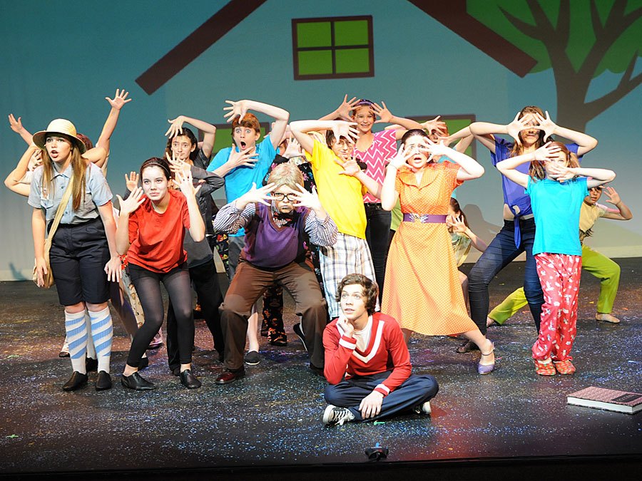 Children's cast on stage acting