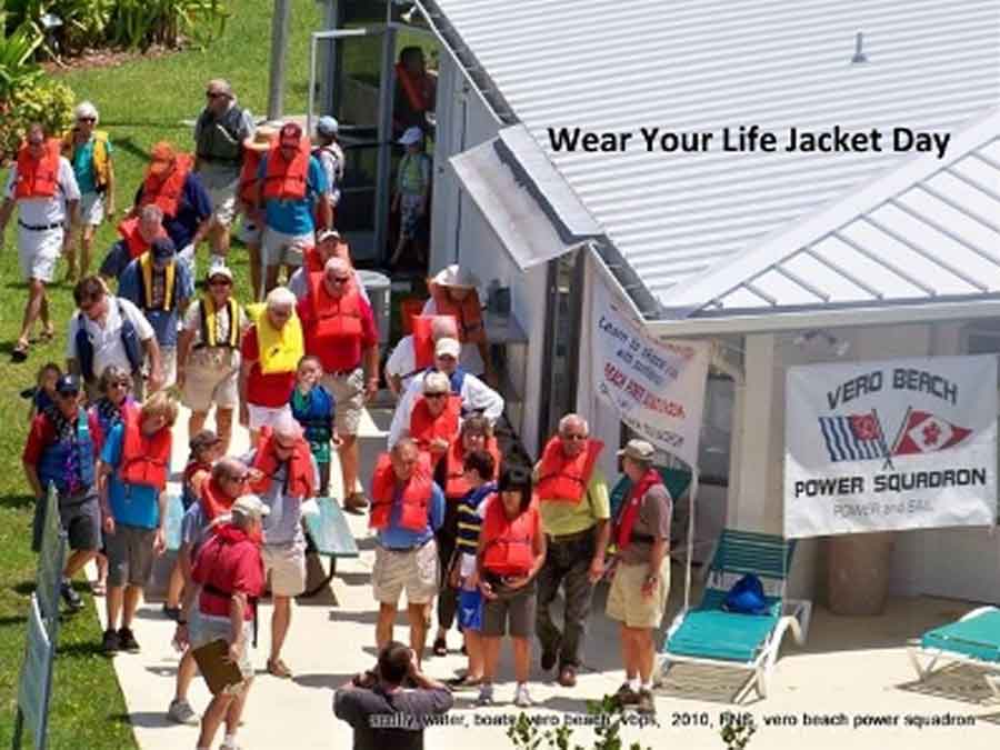 A group of people wearing life jackets