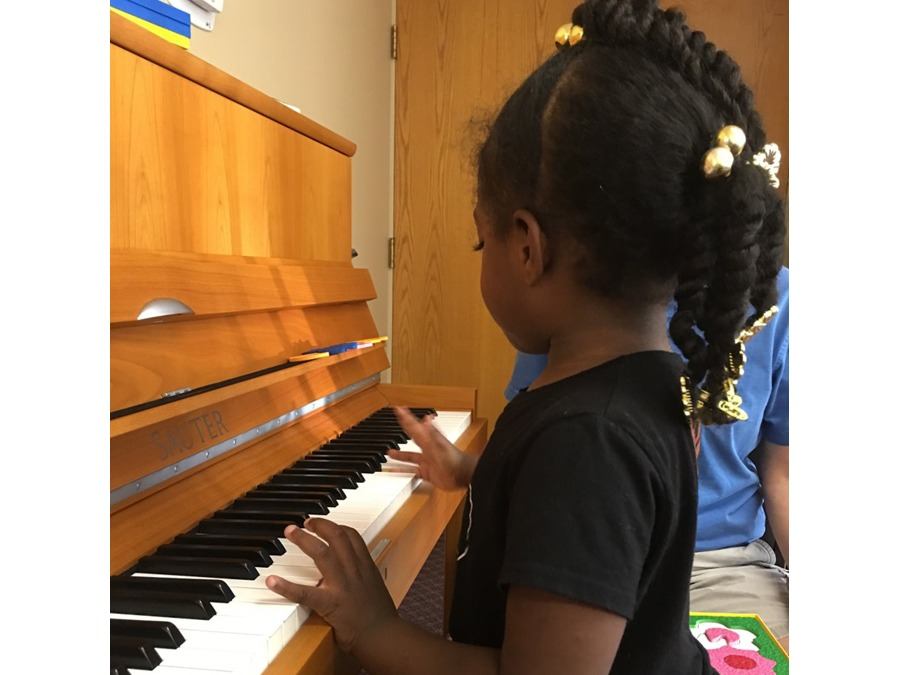 young girl playing piano